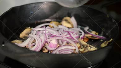 Fried mushrooms in a cast iron skillet.