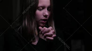 Teen girl praying