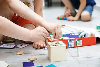 Children playing with homemade educational toys