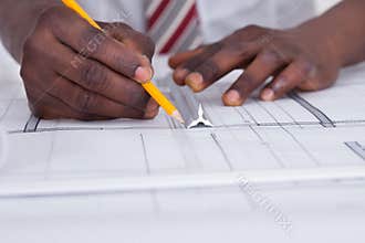 Person Drawing Blueprint