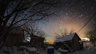 Time lapse of the starry sky in the winter garden