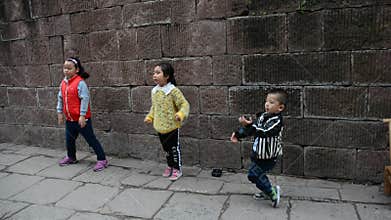 Chinese children dancing on the street