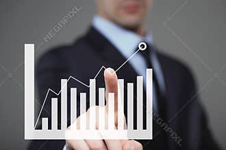 Businessman Touching a Graph Indicating Growth