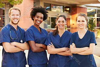 Portrait Of Medical Team Standing Outside Hospital
