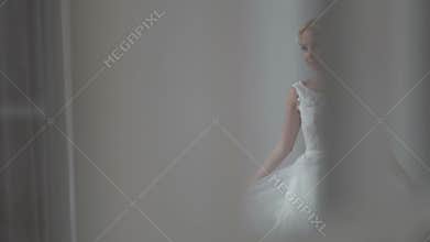 Beautiful bride posing in her wedding dress