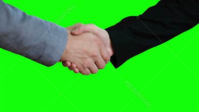 Handshake on the background of a green screen