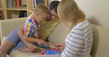 United Family Playing in Toy Fishing Game