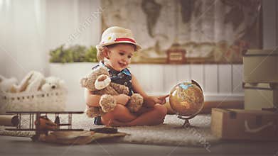 Concept travel. child girl at home dreaming of travel and tourism