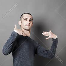 Young man accusing himself or for dynamic self-esteem