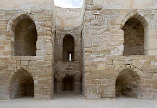 Ruins of old wall with arched cavities