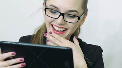 Close up of female face looking at the screen of digital tablet