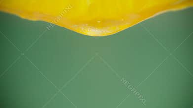 Squeeze out juice. Close up.