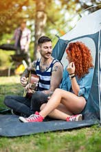 Pleasant atmosphere at summer camp with music and guitar