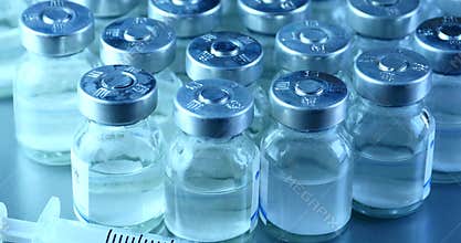 4k close-up of injection bottle&syringe injector.medical equipment&drug vial.