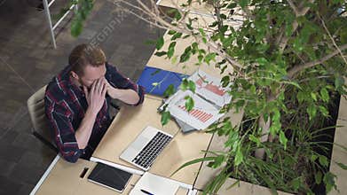 Programmer dials the code and thinks how to solve the problem.