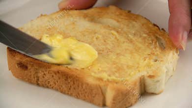 Spreading Butter On Toast