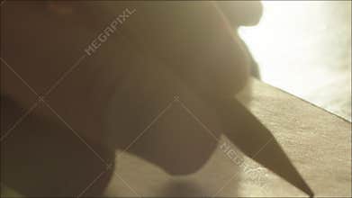 Man Finishing Letter and Signing It