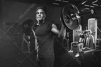 Young and fit couple in the gym doing workout