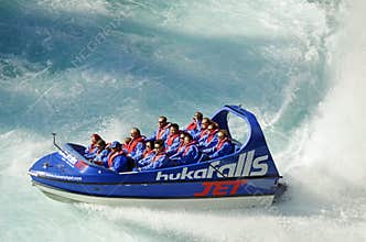 Holiday makers people enjoying thrill of jet boat ride Huka Falls, Lake Taupo, New Zealand