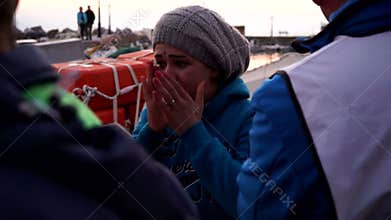 Scared refugee mother. Refugees have just arrived to the coast of Lesvos, Greece.