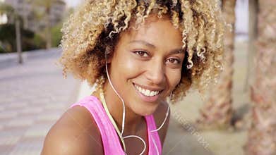 Beautiful girl with afro haircut on the beach