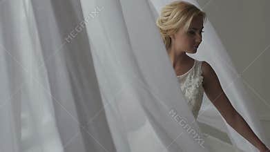 Beautiful bride posing in her wedding dress
