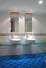 Modern Bathroom Interior with Double Sink and Blue Tiled Floor