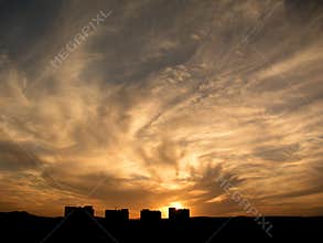 Houses under dramatic sky