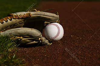 Baseball in glove on the field