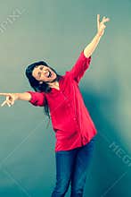 Mad 30s woman laughing with wild body language