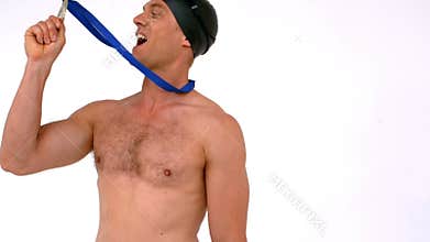Happy swimmer kissing medal