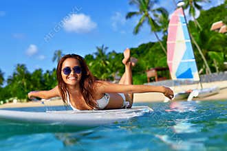 Summer Adventure. Water Sports. Woman Surfing In Sea. Travel Vac