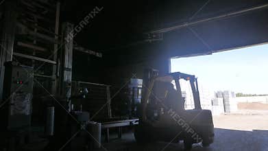 Forklift doing his job at the concrete blocks factory