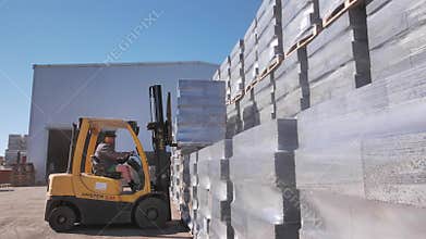 Forklift doing his job at the concrete blocks factory