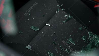 Broken car window of burglary