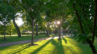 Couple with a bicycle walking.