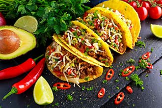 Mexican food - delicious taco shells with ground beef and home made salsa