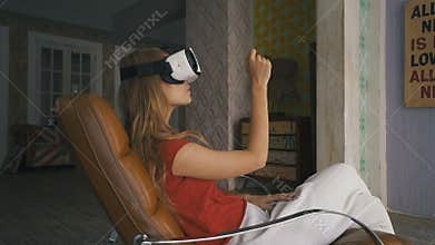 Woman shopping online by VR headset glasses of virtual reality at home