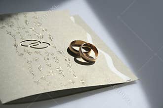 Wedding invitation and rings