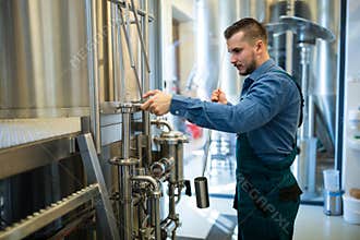 Brewer working at brewery