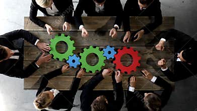 Business people with cogs of business