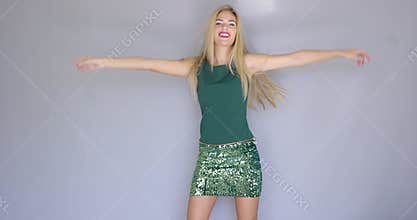 Happy and crazy beautiful young woman dancing