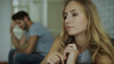 Sad wife looking at her ring after fight with husband