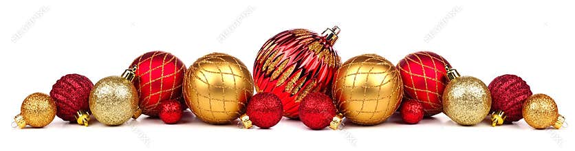 Christmas border of red and gold ornaments isolated on white