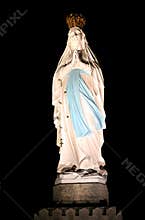 Lighted Virgin Mary in pilgrim town Lourdes