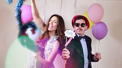 Slow motion of funny crazy couple having awesome time dancing