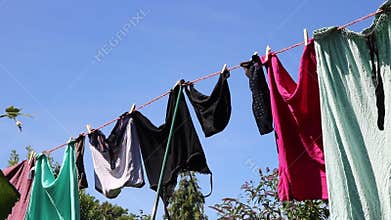 Breeze blowing drying washing on a line.