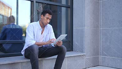 Outdoor Browsing on Tablet Computer, Young Black Handsome Man