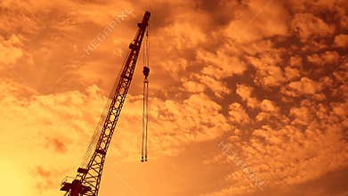 Crane boom with hook sunset video silhouette