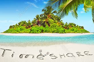 Whole tropical island within atoll in tropical Ocean and inscription "TimeShare" in the sand on a tropical island, Maldives.